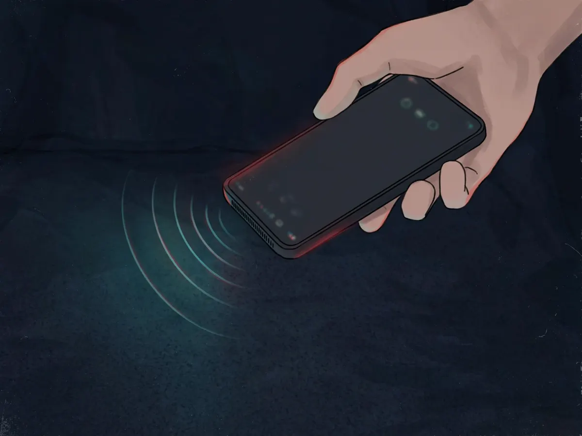 A hand holding a smartphone on speaker over a dark bedroom floor, a faint sound wave rising from the speaker